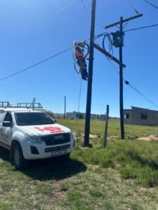 Electrician working on a street pole