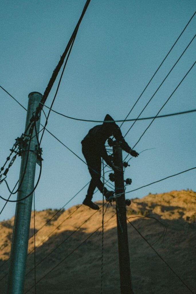 Person fixing a street pole