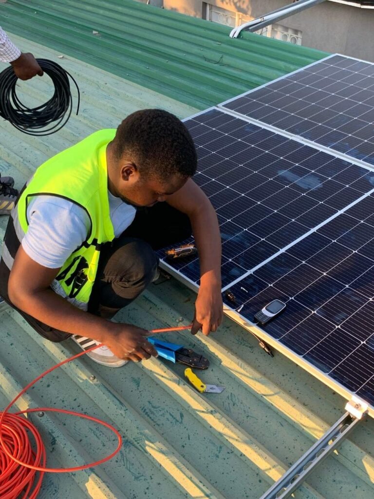 Electrician installing a solar panel